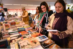 Women taking keen interest in books during the 18th World Urdu Conference at the Arts Council.