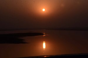 A mesmerizing winter sunset paints the skies with natural colors, captivating every eye over the city