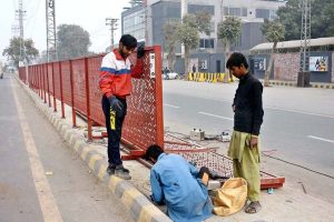 CBD workers are busy installing divider at center path of Walton Road as part of beautification of the Provincial Capital