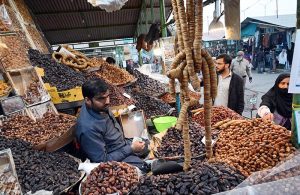 A vendor displaying fish to attract the customers at H-9 Weekly Bazaar in Federal Capital