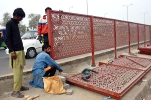 CBD workers are busy installing divider at center path of Walton Road as part of beautification of the Provincial Capital