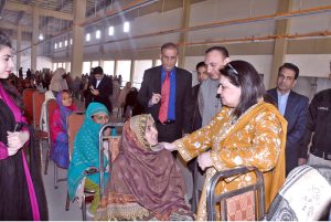 Chairperson Benazir Income Support Programme, Senator Rubina Khalid, addresses beneficiaries during her visit to the SIM Distribution Center at Vista.