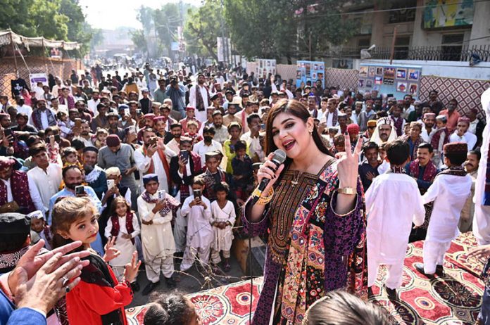 A folk singer performing Sindhi song during Sindhi culture day outside press club