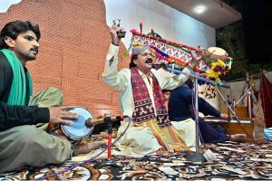 Renowned Sindhi singer Jigar Jalal is giving his best performance on stage during a function on the occasion of Sindh Culture Day at Larkana Press Club.