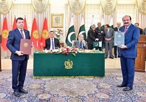 Pakistani Federal Minister exchange MoU with his Kyrgyz counterpart at the ceremony of exchange of MoUs between Pakistan and Kyrgyzstan in various sectors.