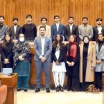 A group photograph of students and faculty members of NUST Law College in the Senate Hall at Parliament House