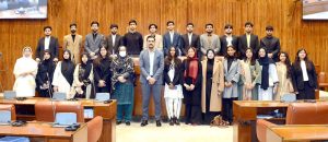 A group photograph of students and faculty members of NUST Law College in the Senate Hall at Parliament House