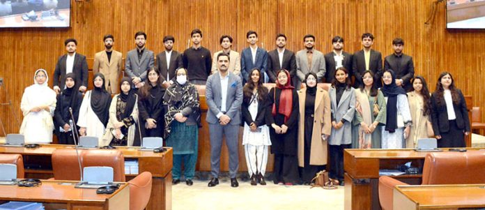 A group photograph of students and faculty members of NUST Law College in the Senate Hall at Parliament House