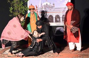 Artists perform in a stage drama “Ishq Faqeer” during the Drama Festival at Z.A. Bhutto Open Air Theatre, Arts Council.