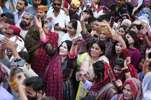 A large group of youngsters perform Sindhi dance wearing traditional Sindhi caps during Sindhi Culture Day outside the Press Club