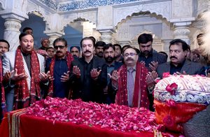 Prime Minister of Azad Kashmir Raja Faisal Mumtaz Rathore offering Fateha on the grave of Shaheed Mohtarma Benazir Bhutto at Garhi Khuda Bakhsh.