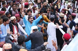A large group of youngsters perform Sindhi dance wearing traditional Sindhi caps during Sindhi Culture Day outside the Press Club