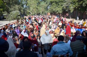 Women registered under the Benazir Income Support Programme (BISP) receiving activated mobile SIMs to access their quarterly installment of Rs13,500 directly through ATM messages, bypassing agents. Special facilitation counters have been set up across the district.
