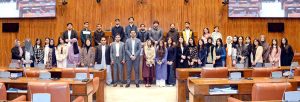 A group photograph of students and faculty members of NUST Law College in the Senate Hall at Parliament House