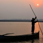 The final sunset of 2025 melts into the River Indus, painting the waters with gold, fire, and quiet reflection.