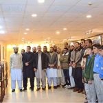 Students and faculty members of Government Boys High School Jaglari pose for a group photograph in the Senate Hall at Parliament House