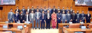 A group photograph of students and faculty members of NUST Law College in the Senate Hall at Parliament House