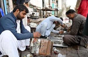 A mechanic is busy repairing a gas heater in his roadside workshop as the demand for domestic gas appliances is high with the onset of cold weather.