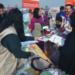 Female visitors explore various stalls during the 16 Days of Activism event at Hayatabad Sports Complex, highlighting unity, hope, and a collective commitment to end violence against women and girls