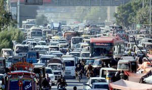 Traffic jam outside the discount market near Rashid Minhas Road, Bagh-e-Karachi, caused by roadside stalls”.
