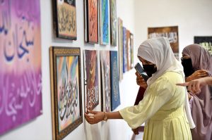 Art enthusiasts taking a keen interest in the calligraphy artworks on display at an exhibition showcasing the remarkable talent of students from PNCA’s ongoing Calligraphy Classes. The exhibition reflects their dedication, creativity, and artistic growth throughout the course.