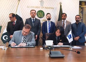 Secretary Economic Affairs, Muhammad Humair Karim, and Country Director of Asian Development Bank, Emma Fan, Signing Agreements between Pakistan and ADB.