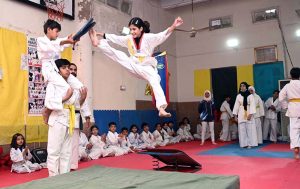 Martial arts students demonstrate their skills during the Belt Promotion Ceremony at the Karate Academy, University of Sargodha.