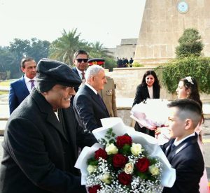 President Asif Ali Zardari being presented with a bouquet upon his arrival at the Presidential Palace.
