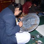 Students engage in calligraphy during a competition at Nusrat Fateh Ali Khan Auditorium of the Arts Council in the city’s textile hub.