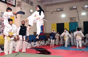 Martial arts students demonstrate their skills during the Belt Promotion Ceremony at the Karate Academy, University of Sargodha.
