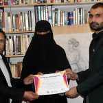 Muhammad Shoaib Ayoub Batalvi, chief guest, with Tariq Saeed, founder of The Knowledge of Art Academy, distributing certificates during the ceremony