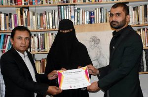 Muhammad Shoaib Ayoub Batalvi, chief guest, with Tariq Saeed, founder of The Knowledge of Art Academy, distributing certificates during the ceremony