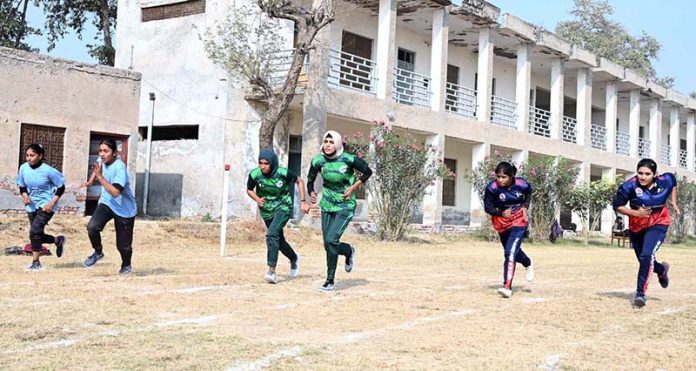 Athletes participate in a race during the Inter-Collegiate Girls’ Athletic Championship at the Education Board Ground