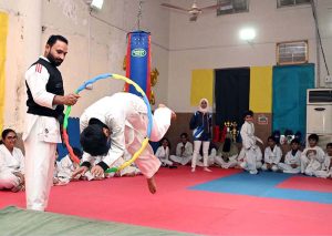 Martial arts students demonstrate their skills during the Belt Promotion Ceremony at the Karate Academy, University of Sargodha.