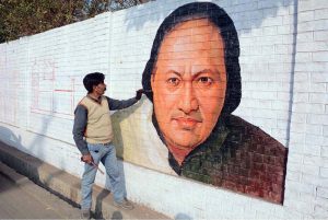 Students engage in calligraphy during a competition at Nusrat Fateh Ali Khan Auditorium of the Arts Council in the city’s textile hub.