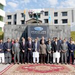 Prime Minister Muhammad Shehbaz Sharif in a group photo with the administration of Kashmir Institute of Nuclear Medicine, Oncology and Radiotherapy.