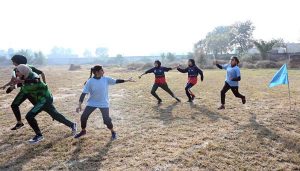 Athletes participate in a race during the Inter-Collegiate Girls’ Athletic Championship at the Education Board Ground