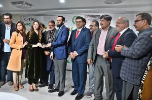 Federal Minister for Information and Broadcasting Attaullah Tarar presents Christmas gifts to members of the Christian community at a Christmas Eve ceremony organized by the National Press Club Islamabad, in collaboration with Medic Galleria and the Zakat Foundation of America. APP/ADZ/MAF/ABB