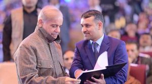 Prime Minister Muhammad Shehbaz Sharif interacts with students at the ceremony of distribution of laptops in the University of Azad Jammu and Kashmir.