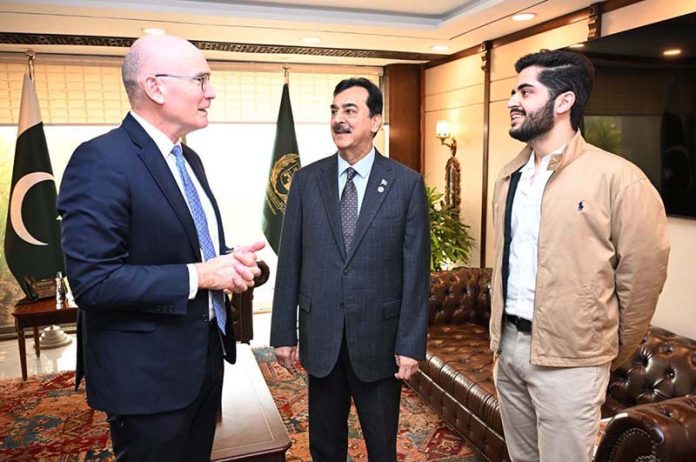 Chairman Senate Syed Yousaf Raza Gilani introduces his grandson, Mohammad Asfandyar Gilani, to Australian High Commissioner Mr. Timothy Kane at Parliament House