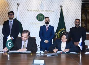 Secretary Economic Affairs Division, Muhammad Humair Karim, and Country Director of Asian Development Bank, Emma Fan, signing agreement between Pakistan and ADB