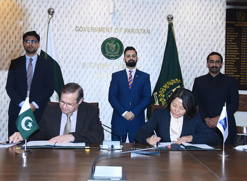 Secretary Economic Affairs Division, Muhammad Humair Karim, and Country Director of Asian Development Bank, Emma Fan, signing agreement between Pakistan and ADB