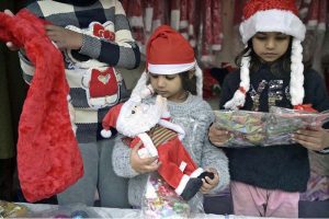 A vendor displays and sells Christmas-themed toys and accessories at a stall in the G-7 area of the Federal Capital.