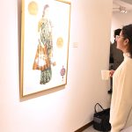 A visitor views the artwork displayed at the “Unveiling Persia” exhibition by Shakil Saigol at Tanzara Art Gallery.