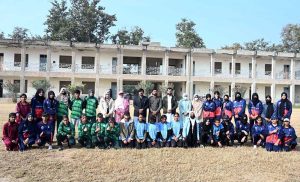 A group photograph of Secretary Education Board Syed Abu-ul-Hassan Naqvi and Director Sports Education Board Chaudhary Anees Gujjar with players during the Inter-Collegiate Girls’ Athletic Championship at the Education Board Ground