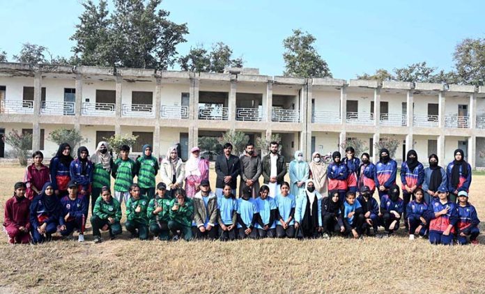 A group photograph of Secretary Education Board Syed Abu-ul-Hassan Naqvi and Director Sports Education Board Chaudhary Anees Gujjar with players during the Inter-Collegiate Girls’ Athletic Championship at the Education Board Ground