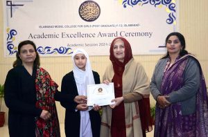 Director of Institute of Food Science Prof. Dr. Anjum Murtaza and Coach Muhammad Naeem Khan distributes certificates to the players during the belt promotion ceremony at Karate Academy, University of Sargodha.