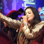 A folk singer performs during the 11th Ayaz Mela organized by Khana Badosh Writers Cafe at the Sindh Museum.