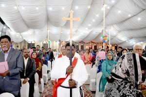 Christian Community members performing religious rituals on Christmas Day at Church.