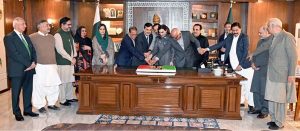 Chairman Senate Syed Yousaf Raza Gilani, along with senators, cuts a cake to mark the 58th Youm-e-Tasees of the Pakistan People’s Party (PPP) at Parliament House